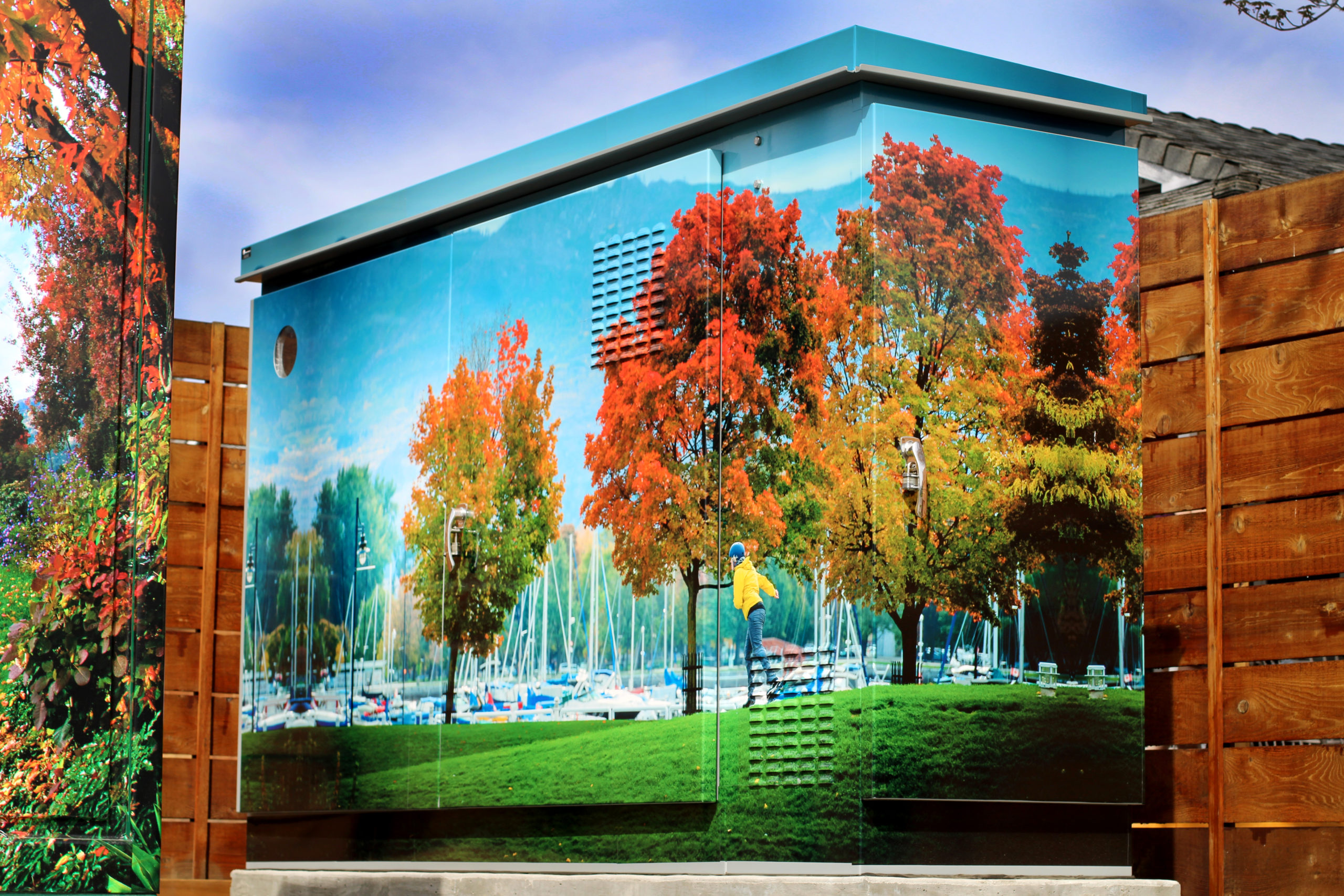 water and wastewater management lift station with a beautiful mural painted of trees in a park