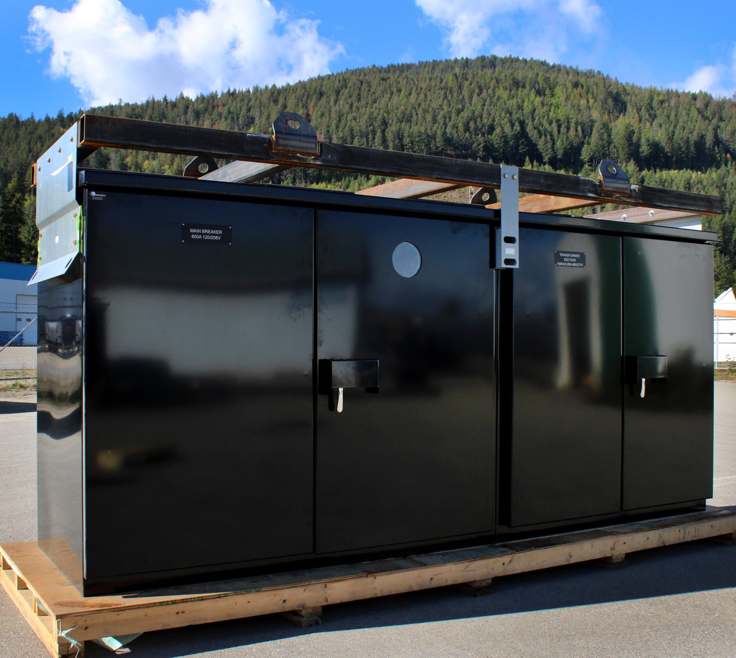 A large black electrical kiosk unit relating to Valid Acquiring West Coast Electric.