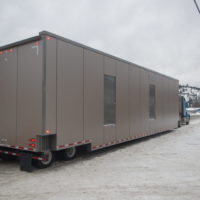 Angled view of modular RCMP holding cell trailer.
