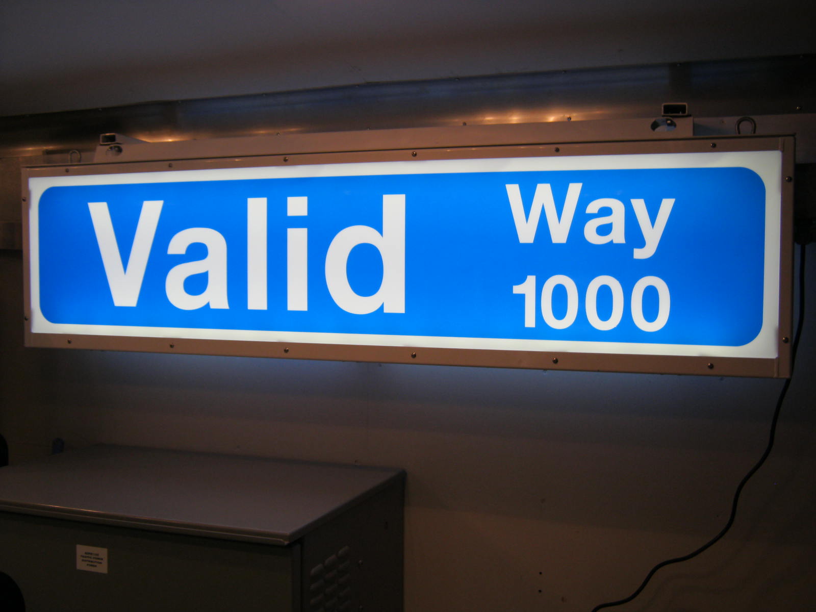 Blue Illuminated Street Sign with the text "Valid Way 1000" on the sign.