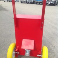 Back view of a red portable power distribution product in a parking lot.
